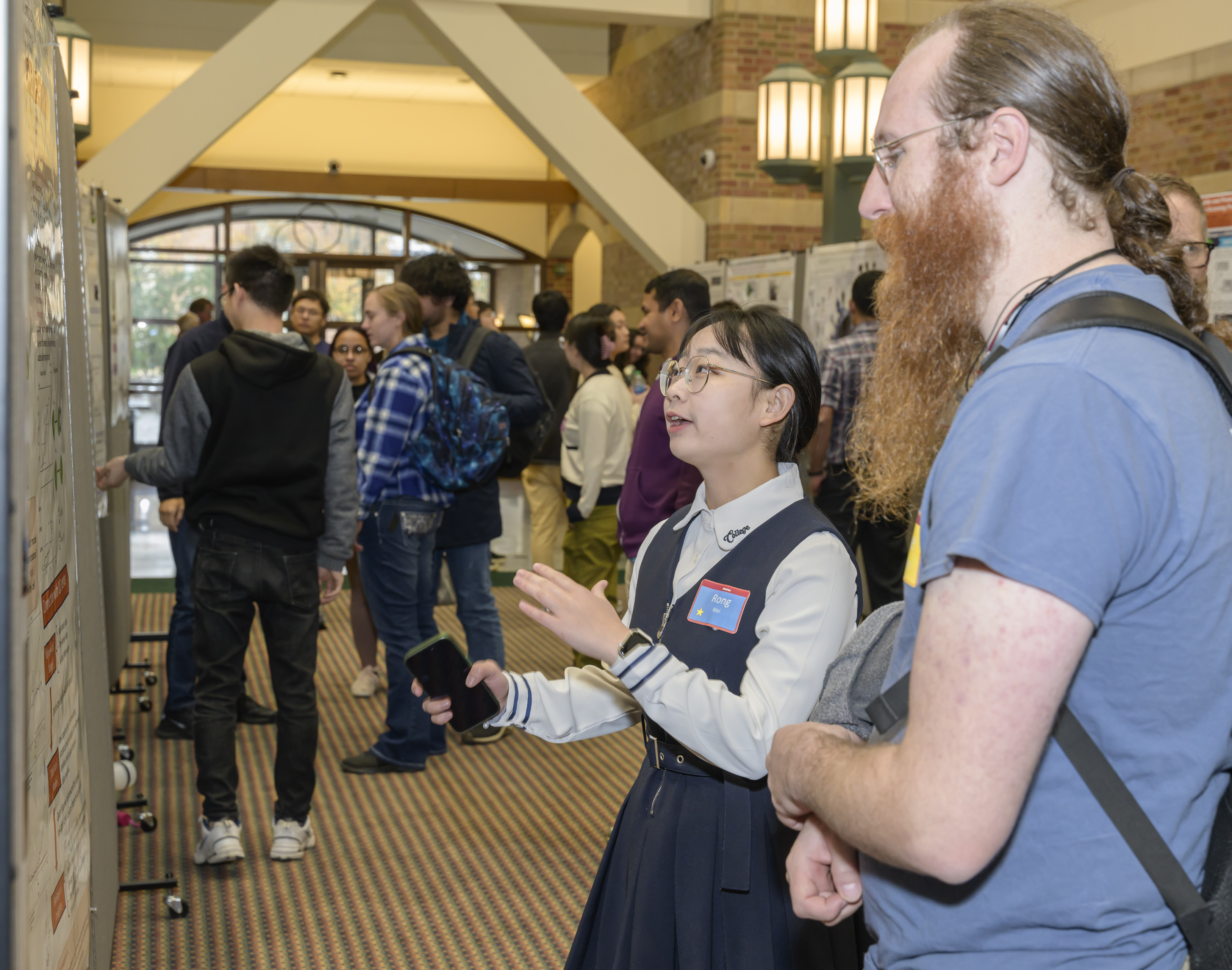 Group of people at a poster session